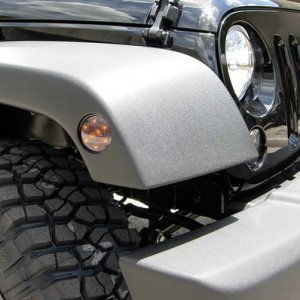 Dales Superstore Recon Lighting:

http://dalessuperstore.com/i-7328427-recon-264135bk-led-front-fender-lens-smoked-for-jeep-wrangler-jk-07-14.html?ref