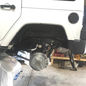 Bagged Brake Assembly of 2017 JK Jeep Wrangler Unlimited to protect from overspray